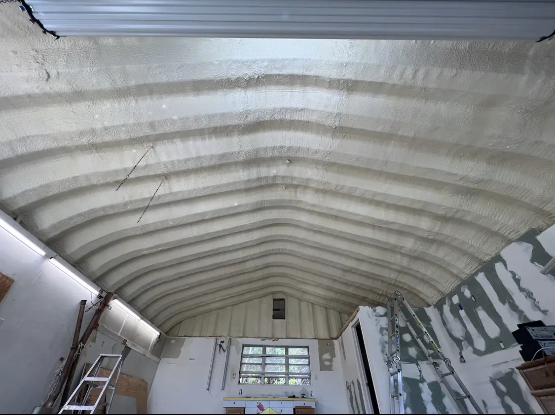 Spray polyurethane foam applied to the underside of a metal roof deck in Frankfort Square